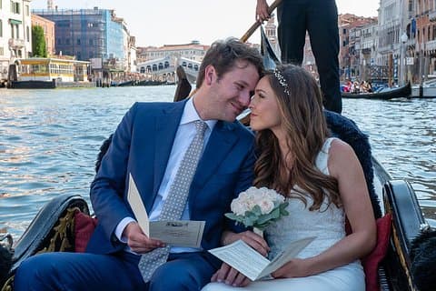 Couple in gondola with bouquet