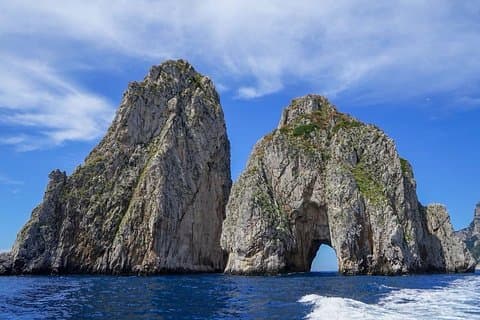 It's thrilling to cruise right through the whole in the Faraglioni rocks!