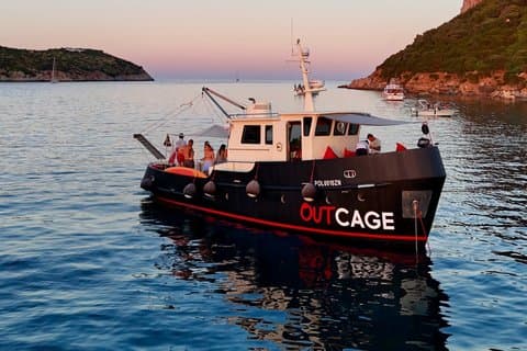 Golfo Aranci sunset on luxury yacht with dolphins and aperitif