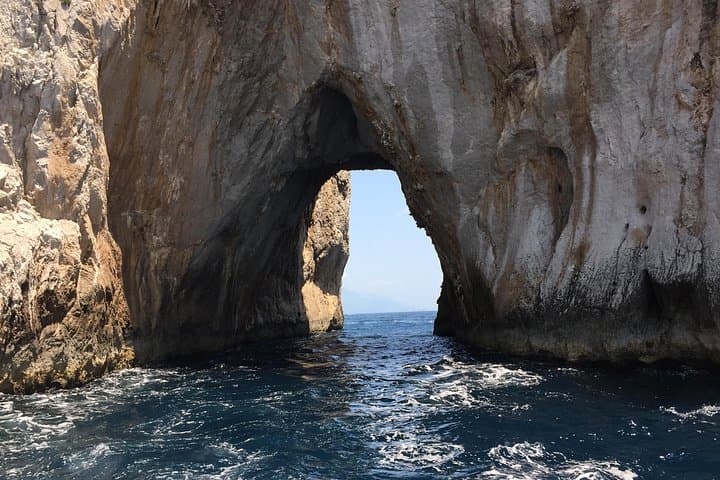 Cruise through the middle of the Faraglioni rocks!