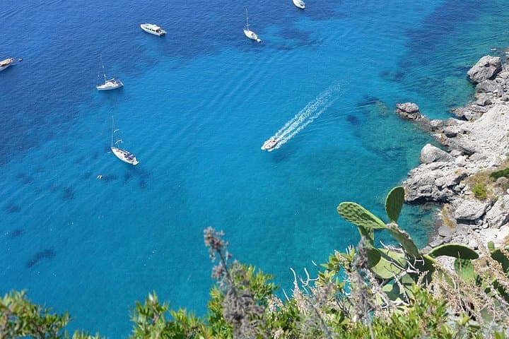 Cruise around the island and swim in the turquoise sea
