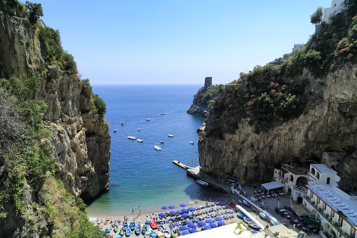 Meet your captain and boat at the pretty La Praia beach in Praiano