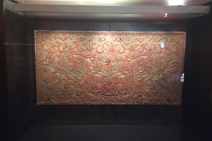 Coral and Gold Tapestry inside art museum of Castelbuono