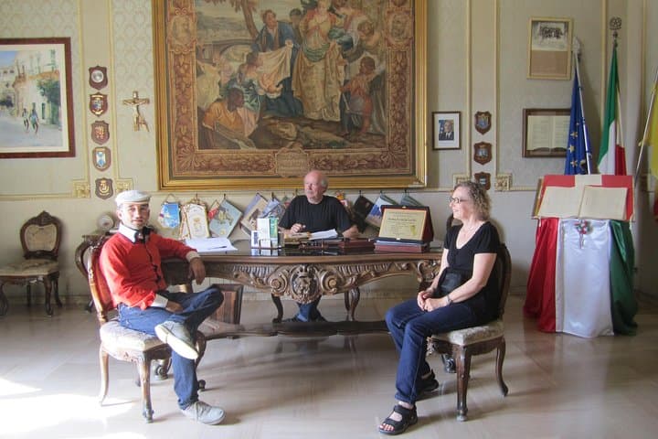 Fans with Luciano in office of police