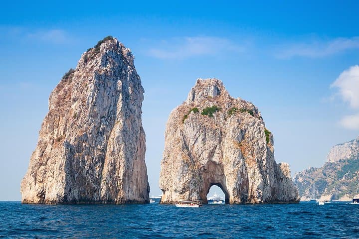 Spend the day seeing the highlights like the Faraglioni rocks