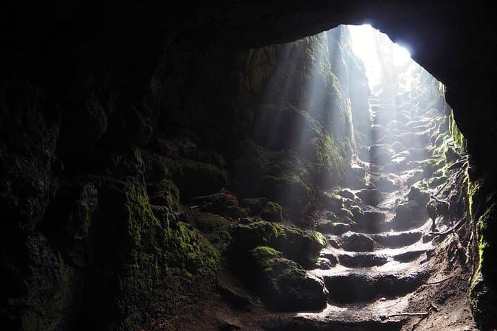 You will visit a volcanic cave with lights and helmets