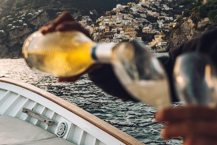 Taste a glass of Champagne while admiring Positano.