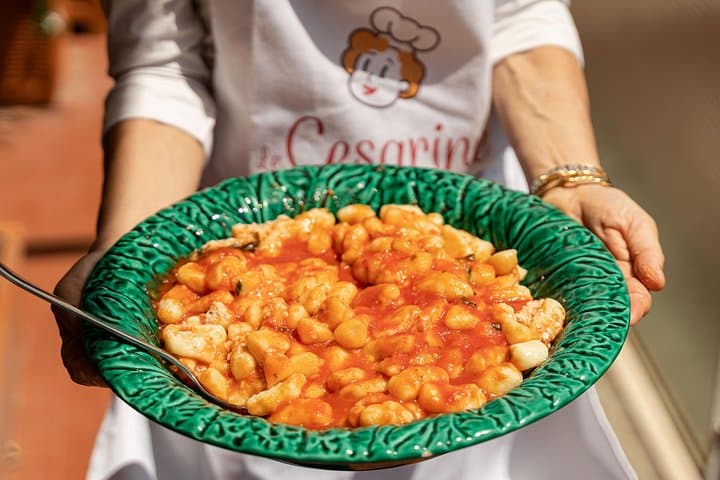 Dining experience at a local's home in Civitavecchia with show cooking