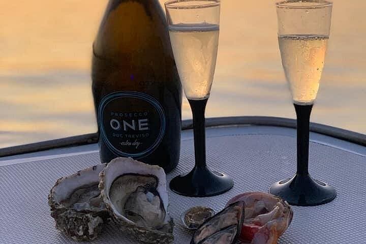 Syracuse Aperitif boat at Sunset island and sea caves