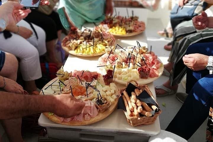 Syracuse Aperitif boat at Sunset island and sea caves