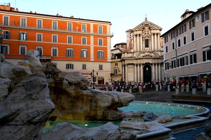 View over the Trevi square from the fountain and the meeting point at the church's entrance