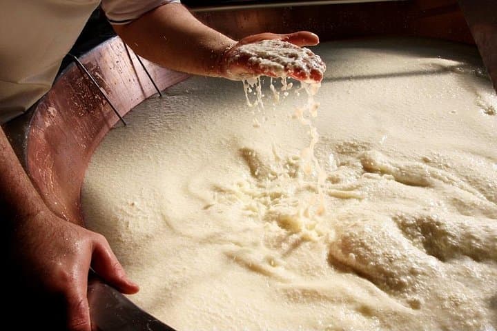 Parmigiano Reggiano & Balsamic Vinegar Private Tour and Tasting | Artemilia Guided tours | Master cheesemaker checking the granules