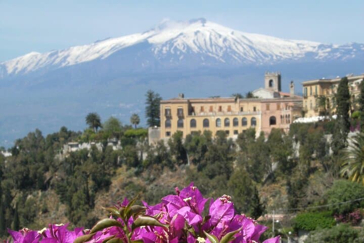 San Domenico Palace and Mount Etna seen from the public gardens