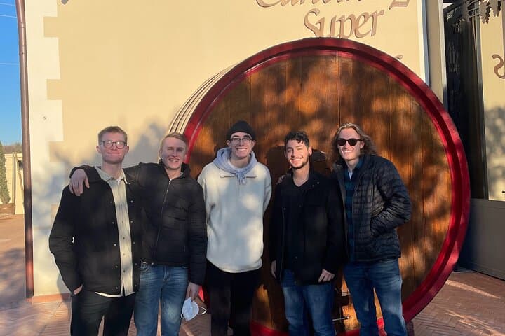 Photo in front of a giant wine barrel