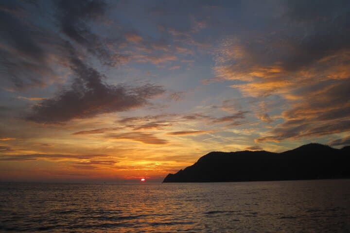 Cinque Terre Sunset Boat Tour Experience with Aperitivo and Swim