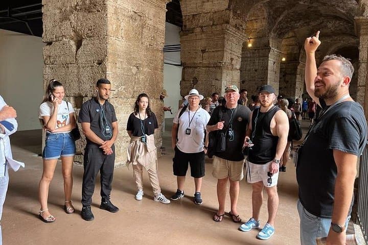 Tour group with licensed Guide inside the Colosseum