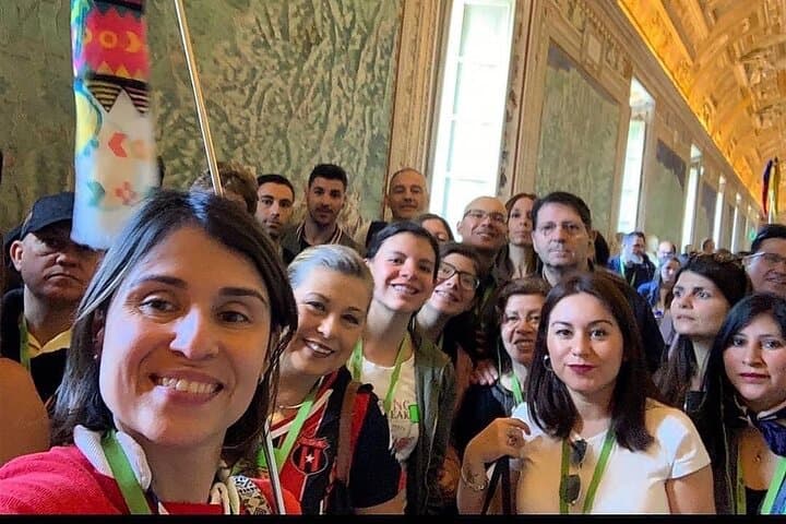 Travelers gathering before entering the Vatican Museums.”