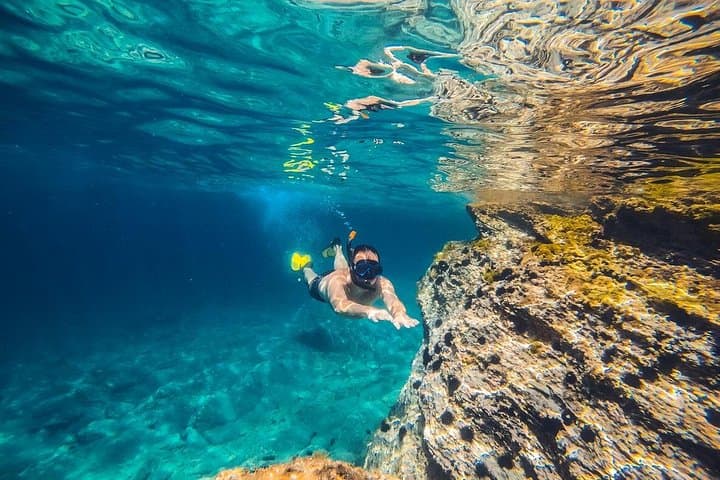 Snorkelling in the clear water of Positano