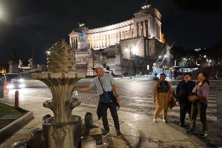 In Piazza Venezia, drinking from the fountain of the pinecone