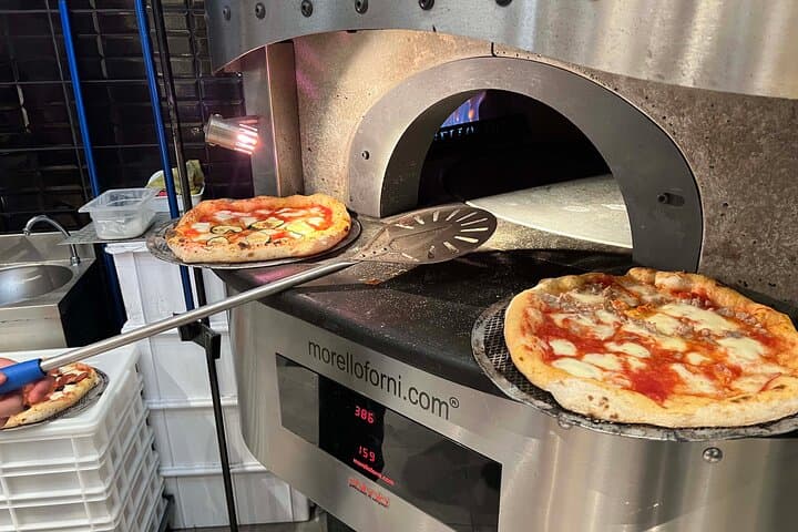 Pizza cooking class in real Pizzeria with Pizza chef & Tour guide