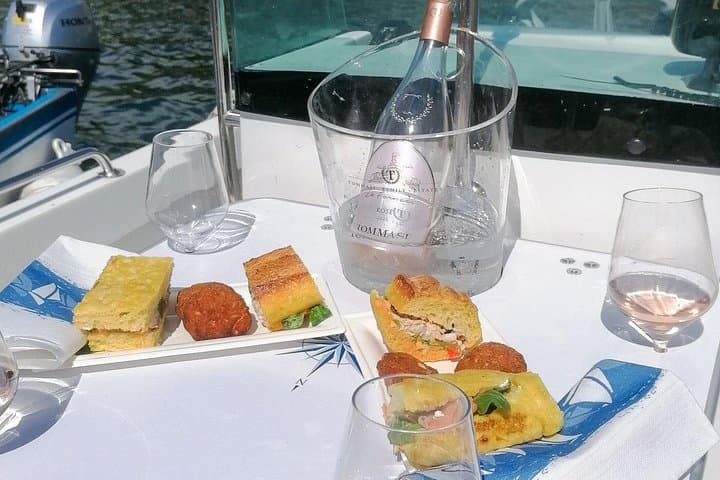 Sunset boat cruise with wine and food tasting from Garda