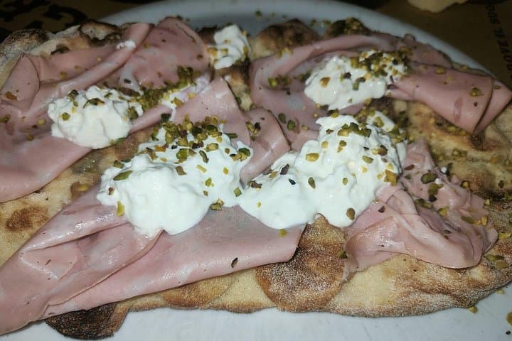 On this tour, you can taste our famous Pizza Bianca with Mortadella while also learning its origin story. You can't miss this fabulous dish.