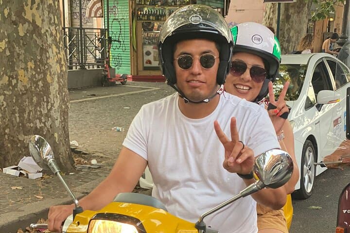 Capturing the essence of Rome, one joyful Vespa ride at a time.