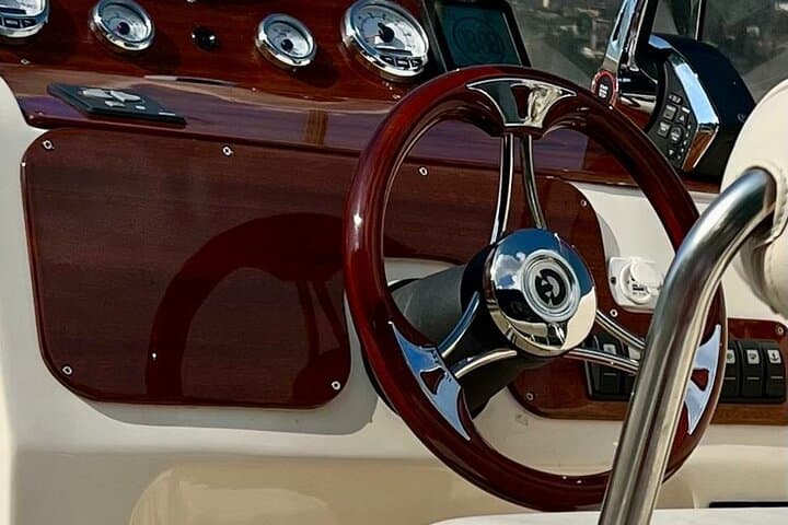 the helm of our luxurious fast motorboat