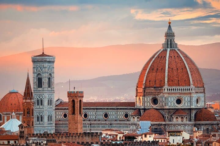 Marvel at the intricate facade, adorned with beautiful marble panels, statues and complex details