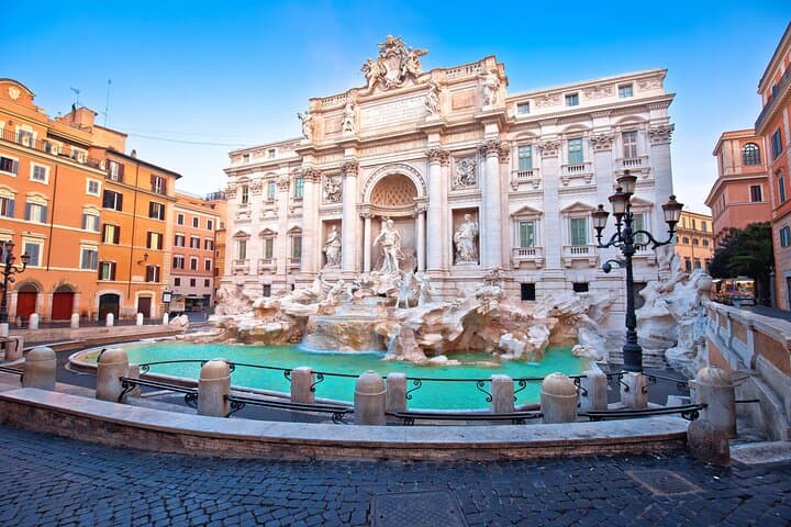 Trevi Fountain located on the above level of Vicus Caprarius