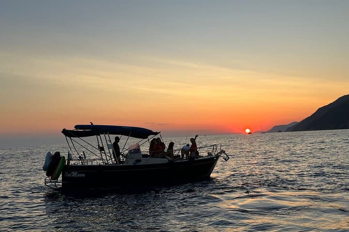 Aperitif on a boat at sunset, Porto Venere and islands
