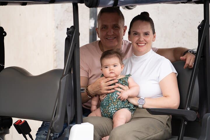 family in golf cart