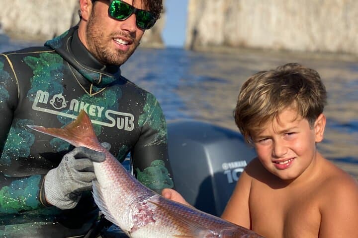 Sub Fishing And Snorkeling In The Waters Of Capri