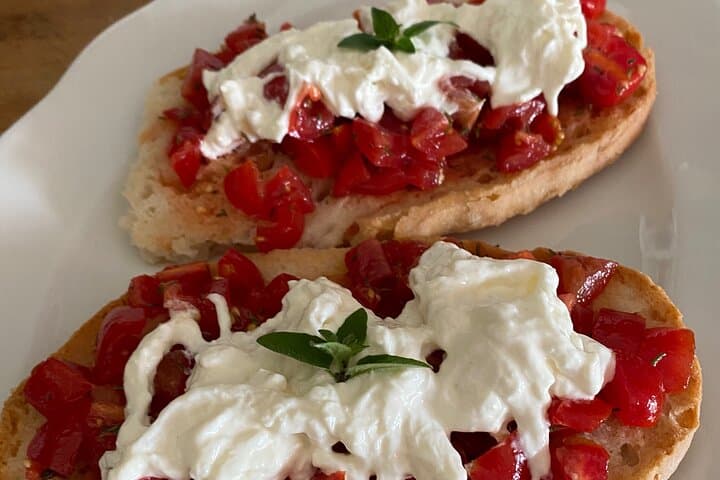 Frise typical cherry tomatoes and stracciatella