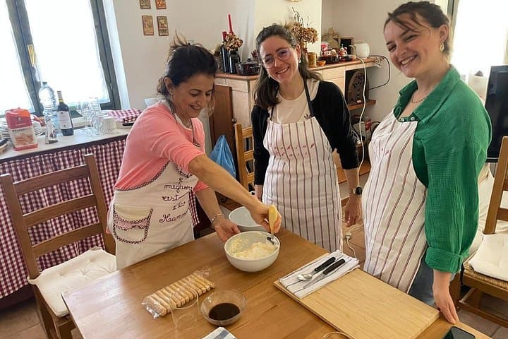 Hands in dough between orecchiette and focaccia in nature