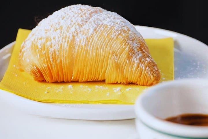 Pair each cup with handcrafted sfogliatelle and the modern classic: the cornetto cubo.