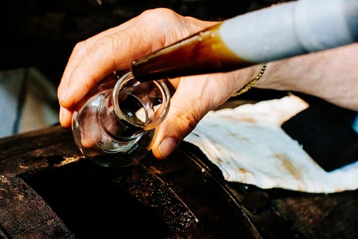 Extracting the vinegar with the pipe in Modena City Center