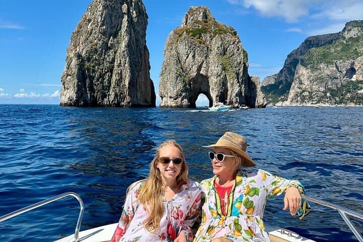 Capture photos by Capri’s iconic Faraglioni rocks.