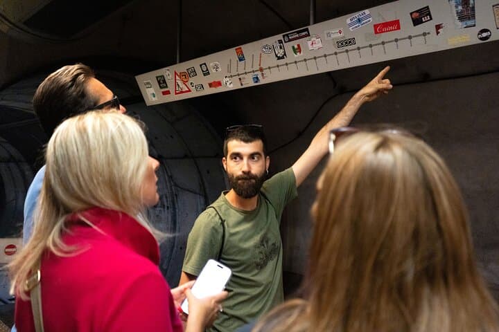 Our knowleadgeble guides teaching about history and art in Naples' subway.