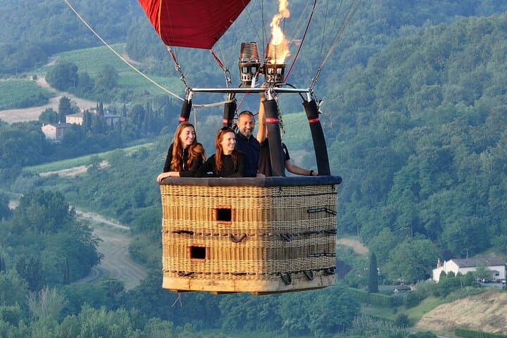 Hot air balloon over the hills of Pienza, Montalcino and Val D'Orcia