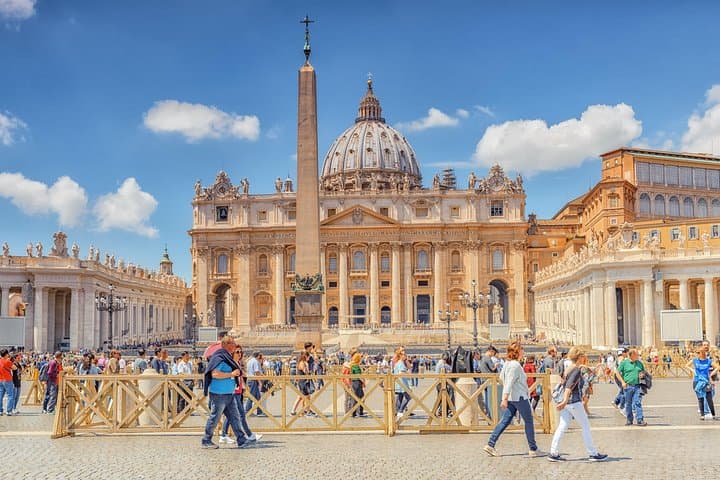 View from St. Peter’s Square in Vatican City in Rome towards the facade and dome of St. Peter’s Basilica, with the central obelisk