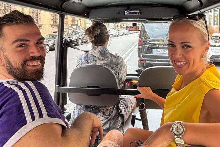 Happy guests enjoying the ride through Rome’s streets — our open-air golf carts make sightseeing comfortable, social, and full of fun!