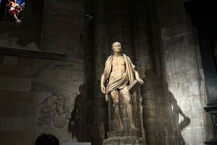 Behold the striking statue of San Bartolomeo in the Duomo di Milano—a masterpiece of anatomical precision and devotion, depicting the saint draped in his own flayed skin