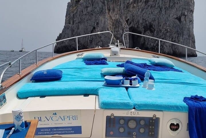 Private Gozzo Boat Tour of Capri with Swim and Local Delicacies
