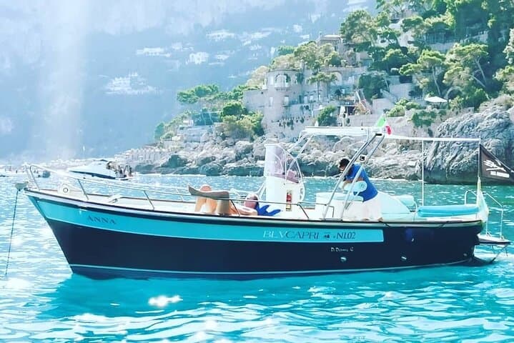 Private Gozzo Boat Tour of Capri with Swim and Local Delicacies