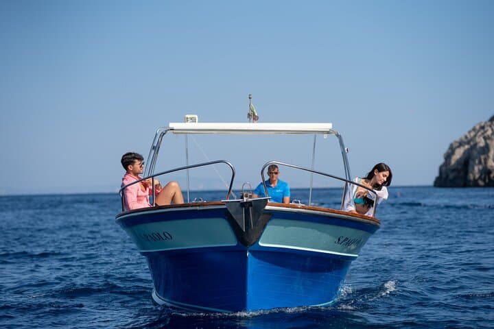 Private Gozzo Boat Tour of Capri with Swim and Local Delicacies