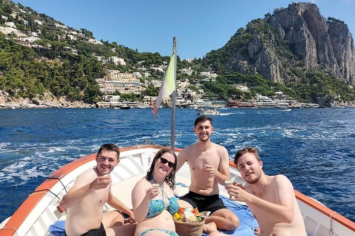 Scenic Capri Boat Tour: Sea Caves, Swimming, Snack and Limoncello