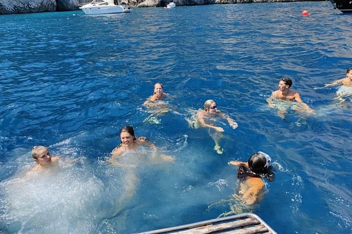 Scenic Capri Boat Tour: Sea Caves, Swimming, Snack and Limoncello