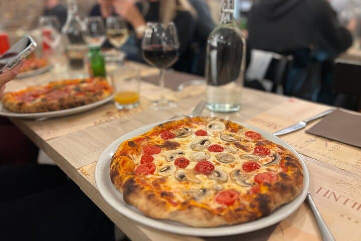 Taste your own creation: fresh from the oven Pizza!