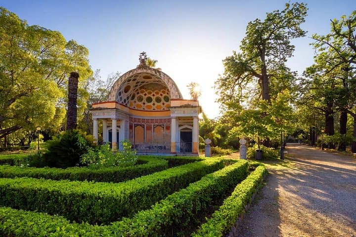 Botanical Garden (Orto Botanico): The calm of the Neoclassical Gymnasium amidst exotic plants.